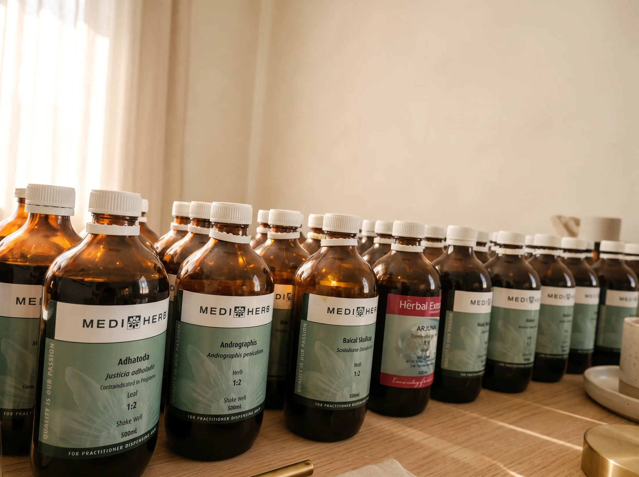 Close view of liquid herbal extract bottles in the dispensary