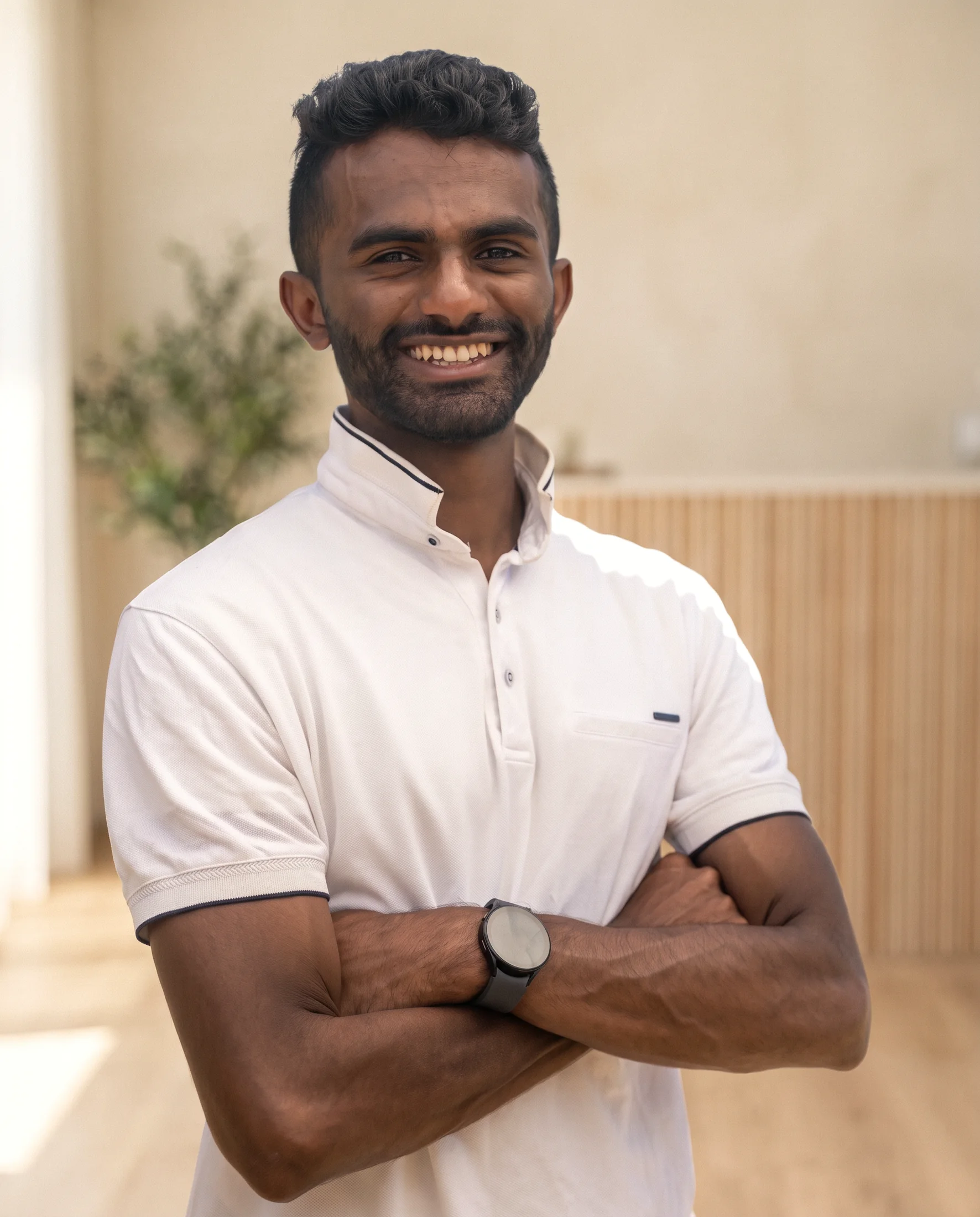 Ahil Ganesan in a white polo shirt at Project Dao